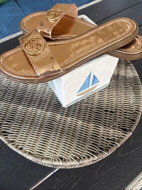 BEBE Metallic Rose Gold Slide Mules with Gold Emblem